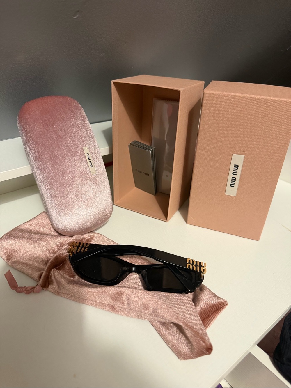Miu Miu Black Cat-Eye Sunglasses with Gold Accent